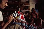 Painting a clay model of Shiva and his consort Parvati, Varanasi, Uttar Pradesh state, India, Asia