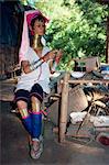 Long necked woman preparing food on the Thai-Burma border in Thailand, Southeast Asia, Asia