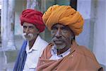 Two men in colourful turbans, Pushkar Camel Fair, Pushkar, Rajasthan State, India, Asia