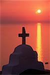 Church cross against the sunset, island of Mykonos, Hora, Cyclades, Greece, Europe