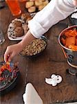 Boy Reaching for Candy at Halloween Party