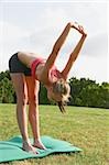 Young Woman doing yoga on mat