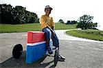 Boy sitting on soap box