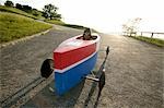 Boy sitting in soap box