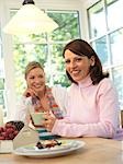 Two women sitting at table