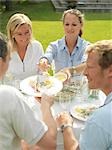 Adults having garden party