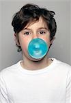 Boy making chewing gum bubble