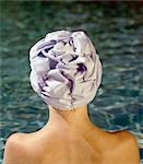 woman wearing a bathing cap, view from behind