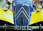 Close-up of front radiator, number plate and lamps on a Citroen 4CV in France, Europe