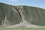 Gully erosion and alluvial fan on hillside 500m high, Nyainqentangla Mountains, Tibet, China, Asia