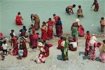 Ritual cleansing in Seti Khola, a tributary of the Ganges, for Nepali New Year, Pokhara, Nepa, Asia