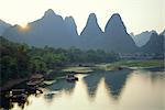In Guilin limestone tower hills rise steeply above the Li River, Yangshuo, Guangxi Province, China