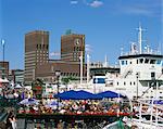 Open air restaurants around harbour, with the Town Hall behind, Oslo, Norway, Scandinavia, Europe