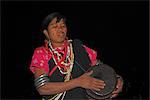 Naga lady dancing and playing drum, Naga New Year festival, Lahe village, Sagaing Division, Myanmar (Burma), Asia