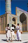 Men reading in front of the Friday Mosque or Masjet-eJam, built in the year 1200 by the Ghorid Sultan Ghiyasyddin on the site of an earlier 10th century mosque, Herat, Herat Province, Afghanistan, Asia