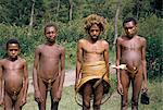 Yani man with Dani men, South Beliam valley, Irian Jaya, Indonesia, Southeast Asia, Asia