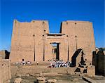 Crowds of tourists in front of the entrance pylon of the temple at Edfu, Egypt, North Africa, Africa
