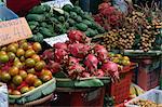 Dragon fruits, oranges and mangoes for sale on a fruit stall at the weekend market in Bangkok, Thailand, Southeast Asia, Asia
