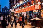 Street scene and St. Paul's cathedral in distance, Macau, China, Asia