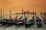 View past docked gondolas towards St. Mark's Square, from across the Grand Canal, Venice, UNESCO World Heritage Site, Veneto, Italy, Europe