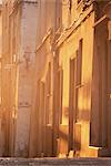 Evening sunlight illuminates a wall in the old town, Bonifacio, Corsica, France, Europe