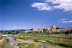 View to village across river, Peralada, near Figueras, Gerona, Catalonia (Cataluna) (Catalunya), Spain, Europe