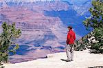 Tourist admiring the view from the South Rim, near Yavapai Point, Grand Canyon National Park, UNESCO World Heritage Site, Arizona, United States of America (U.S.A.), North America