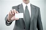 Businessman holding blank business card