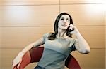 Businesswoman on telephone looking impatient