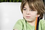 Boy with colored pencils