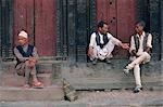 Three men gossiping in Bhaktapur, Nepal, Asia