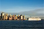 Lower Manhattan skyline and cruise ship across the Hudson River, New York City, New York, United States of America, North America