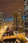 Skyscrapers lining the Chicago River and West Wacker Drive at dusk, Marina City on the right, Chicago, Illinois, United States of America, North America