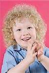 Close-up of a boy clapping