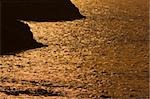 Silhouette of rock formations in the sea at dusk, Biarritz, Basque Country, Pyrenees-Atlantiques, Aquitaine, France