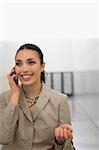 Close-up of a businesswoman talking on a mobile phone and smiling