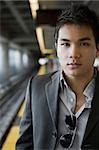 Portrait of a businessman at a subway station