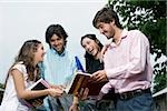 University students discussing and smiling