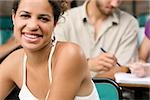 Close-up of two university students sitting in a classroom