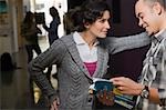 Two university students talking in a corridor