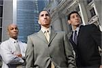 Low angle view of three businessmen standing
