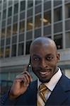 Portrait of a businessman talking on a mobile phone and smiling