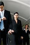 Business executives walking in a subway