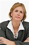 Close-up of a businesswoman thinking with her arms crossed