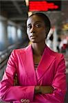 Portrait of a businesswoman standing with her arms crossed at a subway station