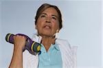 Close-up of a senior woman exercising with a dumbbell