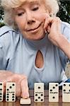 Close-up of a senior woman playing dice
