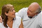 Senior couple sitting in a park