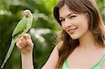 Parrot on a young woman's hand