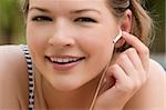 Close-up of a young woman listening to music